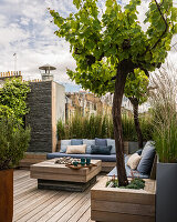 Garden design with custom wooden furniture on roof terrace