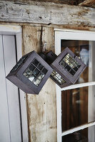 Lanterns hanging outside Litlestol a Wooden cabin situated in the mountains of Sirdal, Norway