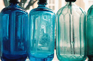 Collection of coloured glass soda siphons