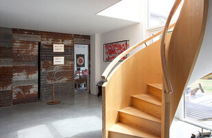 Spiral staircase in spacious entrance hall of Essex home UK