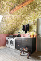 Utility room with plant pattern wallpaper and pink tiles