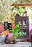 Bathroom with tropical wallpaper pattern and freestanding bathtub