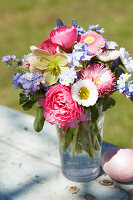 Colourful spring bouquet of bellis, ranunculus and forget-me-nots