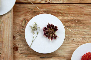 DIY garland made from round discs with flowers