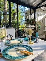 Set table for two in the glass house