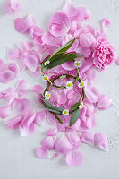 Rose petals and two circlets of twigs adorned with flowers and leaves (wedding mix)