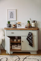 Vintage kitchen cabinet with crockery and decorative elements