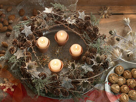 Christmas wreath made of larch twigs, larch cones, dried thistles, and thyme