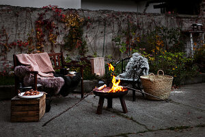 Fire bowl and seating on autumnal terrace