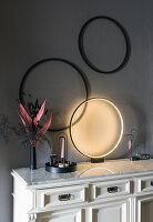 Bureau with circular lamp table lamp