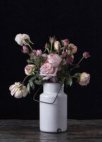 Roses still life in enamel container
