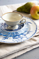 Blue and white place setting with coffee cup