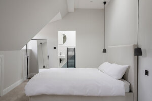 White guest room with private bathroom