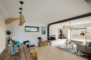 Rustic recycled wood dining table in bright open plan living space