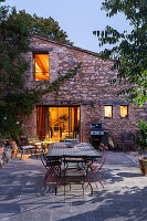 Illuminated country house with patio area