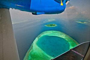 Seaplane flying between Baa Atoll and Malé in the Maldives