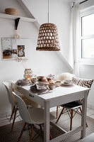 White kitchen table with dishes in beige tones