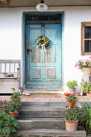 Late summer wreath on a blue wooden door