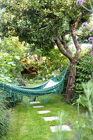 Hammock in lush garden