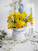 Enamel pot with daffodils