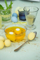 Dyeing Easter eggs in turmeric water