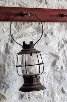 Antique lantern hanging on white wall, Shaker Village of Pleasant Hill, Harrodsburg, Kentucky