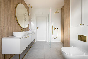 White bathroom in the attic of a detached house with tiles imitating bamboo cladding