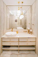 Luxurious bathroom in beige with gold accessories and marble
