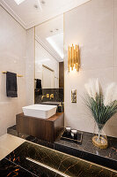 Elegant bathroom with black marble elements