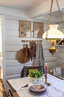 Country-style dining area with hanging lamp and rustic decor