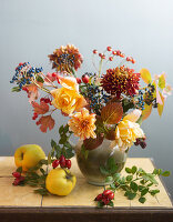 Autumn bouquet with rose hips and quinces