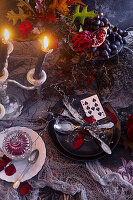 Table decoration with burning candles for Halloween