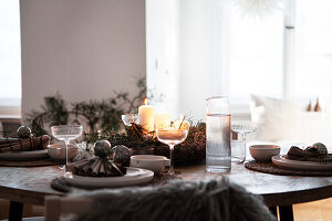 Dining table with candles and Christmas decorations