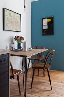 Breakfast table in the kitchen, blue wall in the background