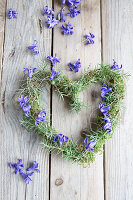 Heart-shaped wreath with hyacinth flowers on a wooden background