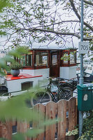 Bicycle parked in front of houseboat