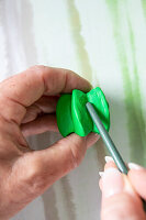 Hand modeling of green clay with a tool