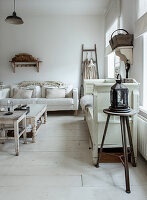 Living room in white with vintage furniture and ladder shelf