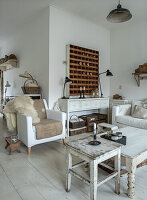 Bright country-style living room with white furniture and antique accents