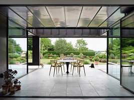 Covered patio seating area with garden view, Hertfordshire, United Kingdom