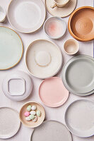 Crockery in pastel colours and sugar eggs for Easter
