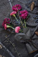 Sloe branches with carnations and autumn chrysanthemums