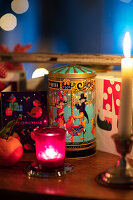 Christmas table with candles, Christmas cards and vintage gift box
