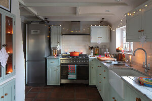 Country kitchen decorated with fairy lights