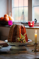 Pandoro with mistletoe on a porcelain bowl