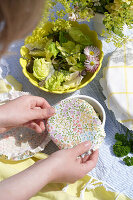 Colourful fabric covers for bowls and fresh salad in the garden