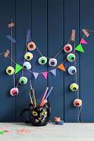 DIY Christmas garland and pennant chain on a blue wooden wall