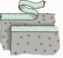 Sewn fabric bag with green bow and red dots