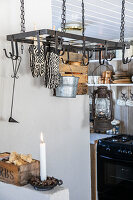 Scandinavian kitchen with metal hanging shelf