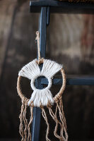 DIY decoration made from macramé and wool on a wooden ladder